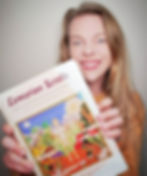 Girl holding lemurian scrolls hindu text book