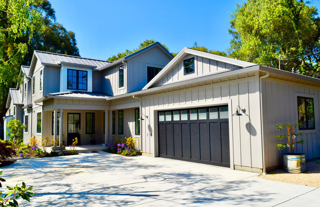 farmhouse-inspired look with curved zinc roofing, a ship lap design, and standing seam installation