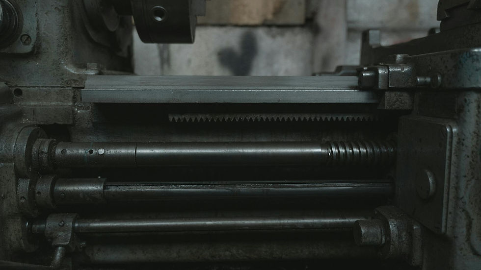 Close-up of a lathe machine highlighting metalwork details in a workshop.
