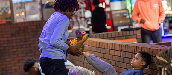 Catherine Omeh assisting a student