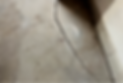 Close-up view of a deep crack in concrete, emphasizing severe structural damage and deterioration.