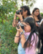 girls taking photos on field trip