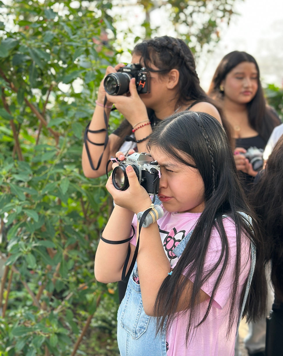 girls taking photos on field trip