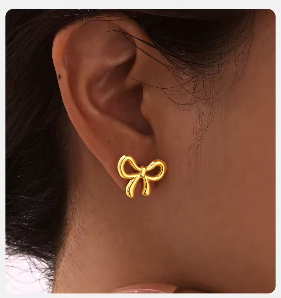 Miniature : Boucles d’oreilles en forme de noeuds dorées