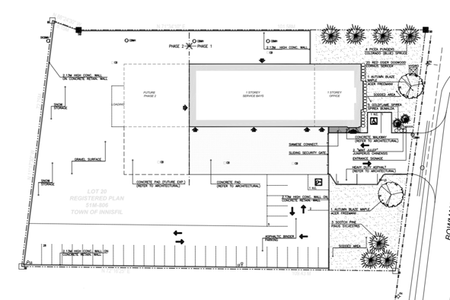 Site plan drawing for a proposed industrial or service facility on Lot 20 in the Town of Innisfil, fronting onto Bowman Street. The plan shows a one-storey building with service bays and office space positioned toward the north side of the property, surrounded by parking areas, loading and circulation routes, security gates, concrete walls, and designated snow storage areas. Landscaped buffers with trees and shrubs line the Bowman Street frontage and entrance, while notes identify future expansion space, utility connections, retaining walls, and site features supporting grading and access.