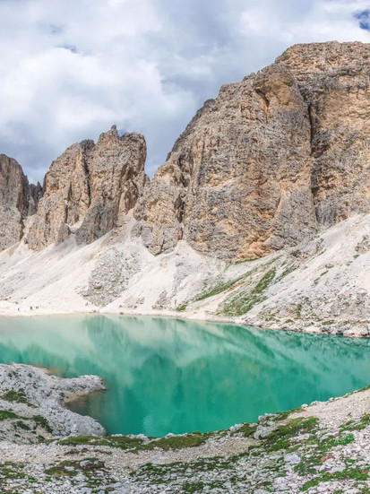 The magical lake of Antermoia below the Dolomite mountain peaks