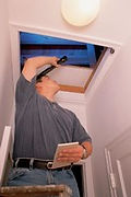 Home inspector with flashlight