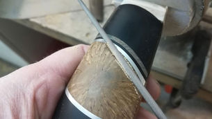 Filningar runt inlägg i knivskaft