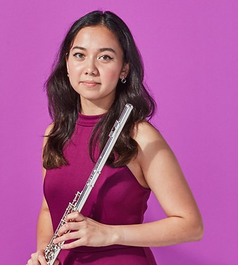 Vanessa Lopez, smiling with flute