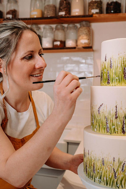 hand painting a british meadow cake