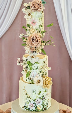 Hand-painted floral tiers with sugar flower detailing, created in 2024, priced at £950.