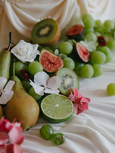 Wedding cake with fresh fruit and flowers