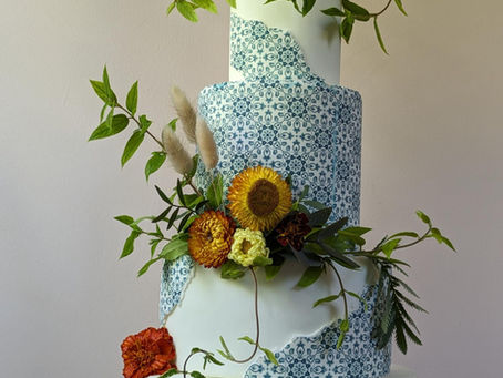 Blue and white greek tile inspired cake with dried flowers