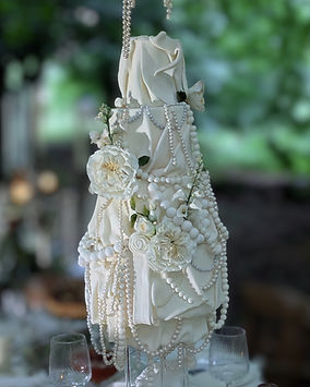 modern wedding cake with sugar draping and sugar pearls