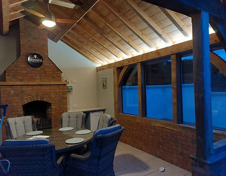 Oak framed extension with red brick fireplace