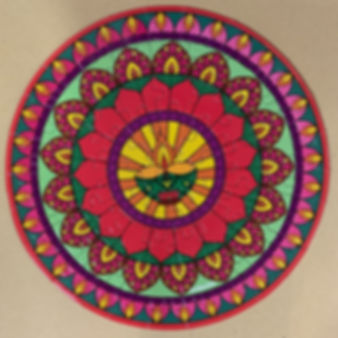 Red and green auspicious rangoli coloured double sided jigsaw puzzle perfect for Diwali as it has a divo (lamp) in the middle