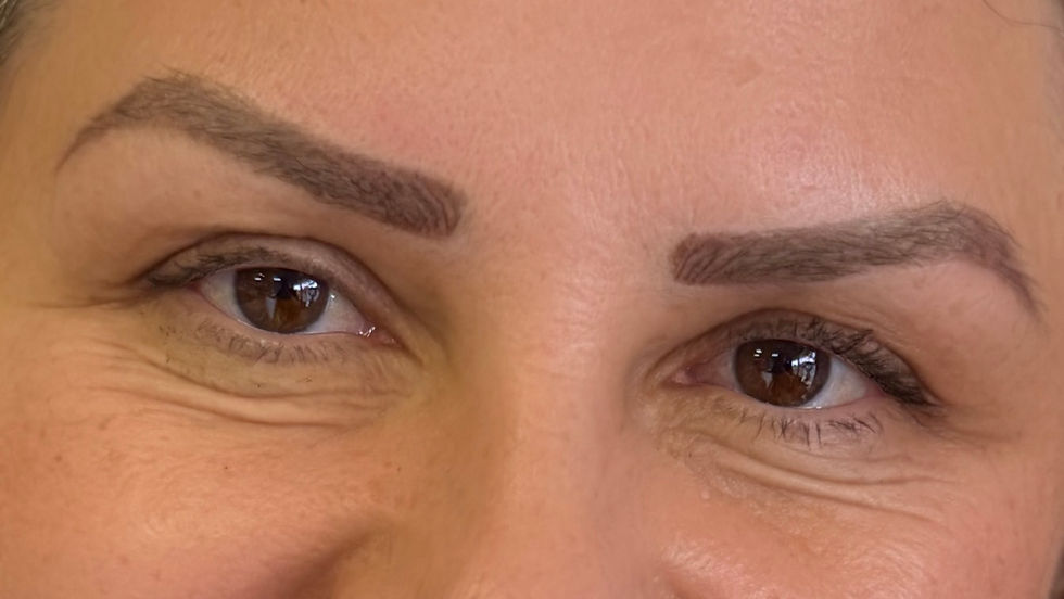 Eye-level view of a microblading tool with pigment