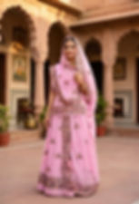 Woman in Roopali Pink Cotton Boutique Suit in a courtyard