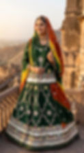 Woman wearing the Vrinda dark green cotton boutique suit.