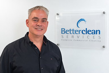 Professional Portrait with Betterclean Services Signage.png