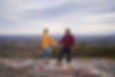 Couple on a mountain top holding hands, Engaged, Spartanburg wedding venue, Greenville wedding venue, SC wedding venue, Upstate SC wedding venue, outdoor wedding ceremony in Spartanburg,  Wedding venue in Spartanburg, Wedding venue in Greenville, Wedding venue in the upstate of SC, all inclusive wedding venue, barn wedding venue, luxury barn venue,  outdoor wedding in Spartanburg, Wedding venue near me, wedding in Moore SC, South Carolina Wedding Venue 