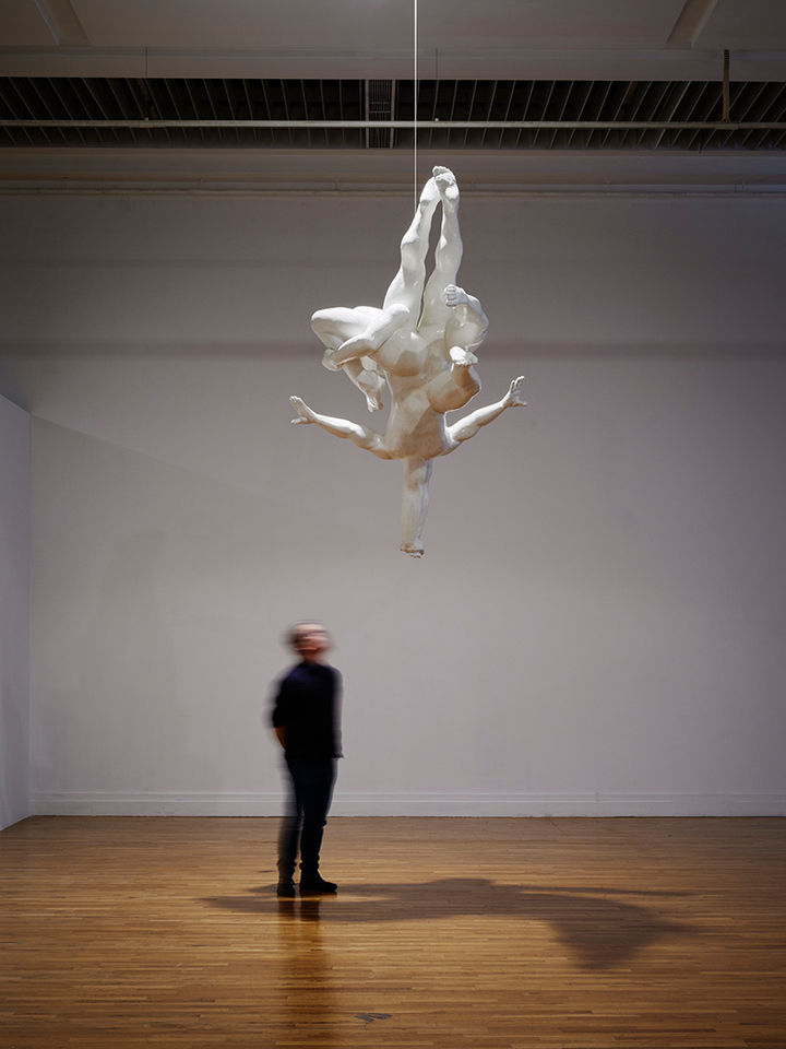 Limbs and torsos are merged together appearing to plunge down like divers