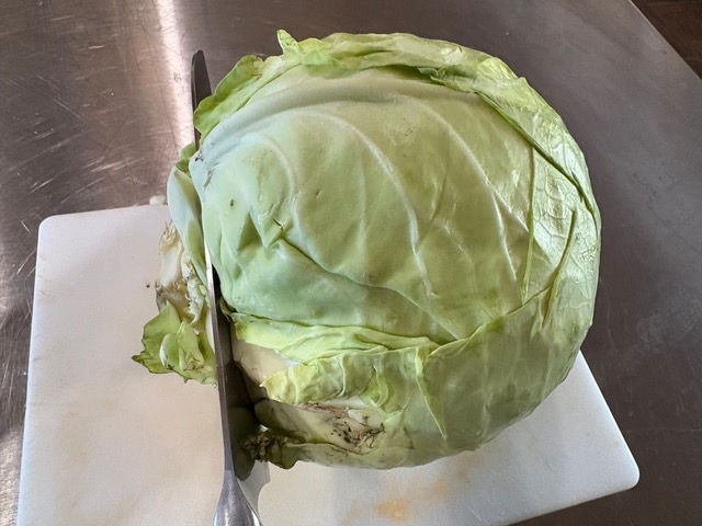 Using a large sharp knife, remove the core from the cabbage.