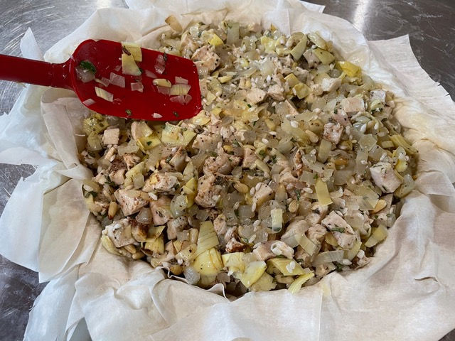 Put the chicken mixture into the pie, smoothing over the top.
