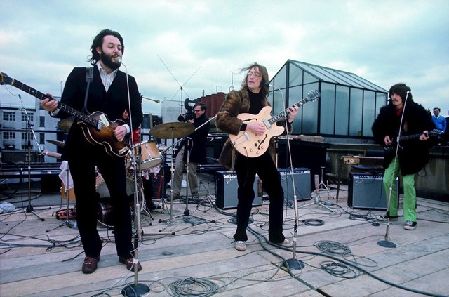 The Beatles play on the roof of Apple Studios in their last public performance together