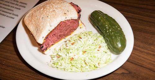 Classic corned beef on rye sandwich with coleslaw and a pickle!