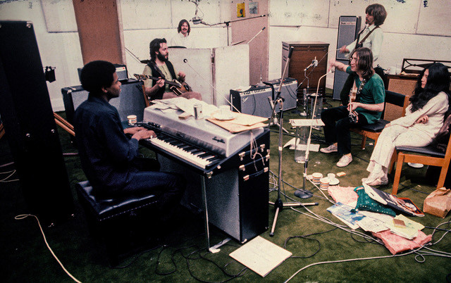 Keyboardist Billy Preston plays as Yoko Ono observes