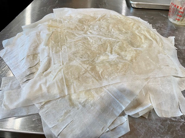Lay the next stack of 7 sheets on top of the tart pan.