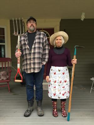 Victoria and John relaxing on the porch of the Rolfe Family Homestead