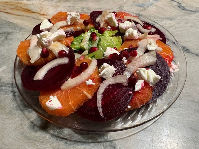 Embellish the salad with scattered fennel and goat cheese.