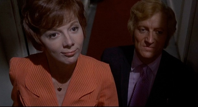 Barry Foster prepares to remove his tie for Barbara Leigh-Hunt in Frenzy (1972)