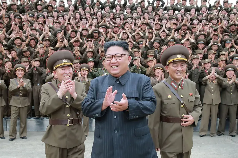 Kim at his military clusterfuck. (STR/KCNA VIA KNS/AFP via Getty Image)