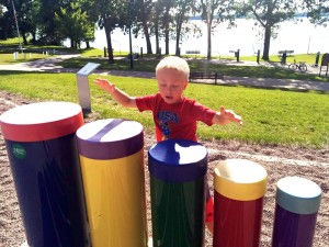Levi Benjamin, son of current Buffalo Rotary President Emily Benjamin plays the drums at the playground at Sturges Park in Buffalo at a Rotary picnic last summer. The drums are one of the 11 instruments along the trail. Contributed photo