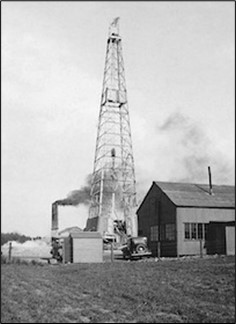 Figure 13 – Midlothian-1 oil field derrick, steam rig and boiler - operated by Esso (1937) Oil field accumulation near the Cousland Anticline, south-east Edinburgh. 31,000 barrels  of oil was found contained within Carboniferous sandstone inter-beds.