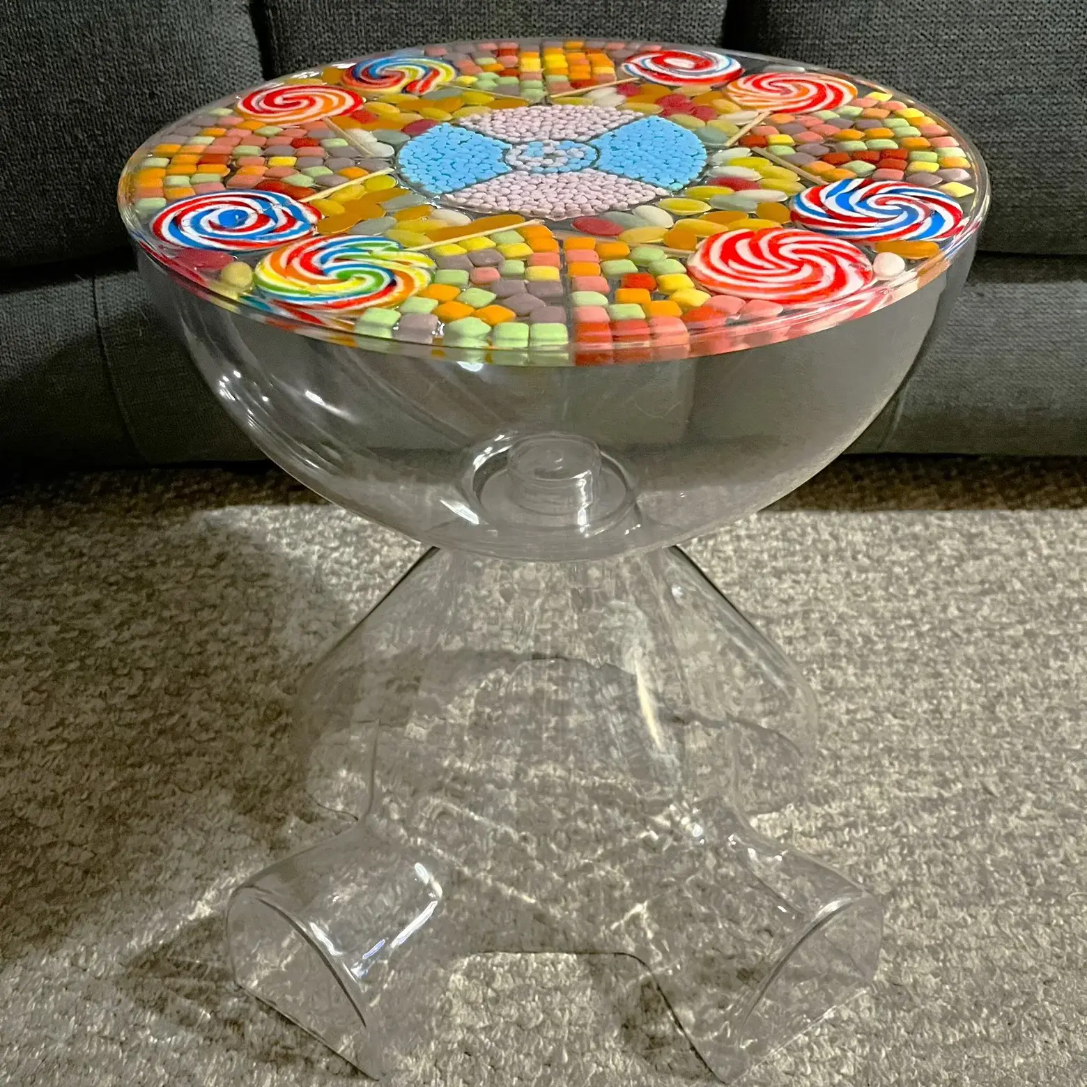 Bear shaped acrylic storage table with sweets embedded in lid, front view