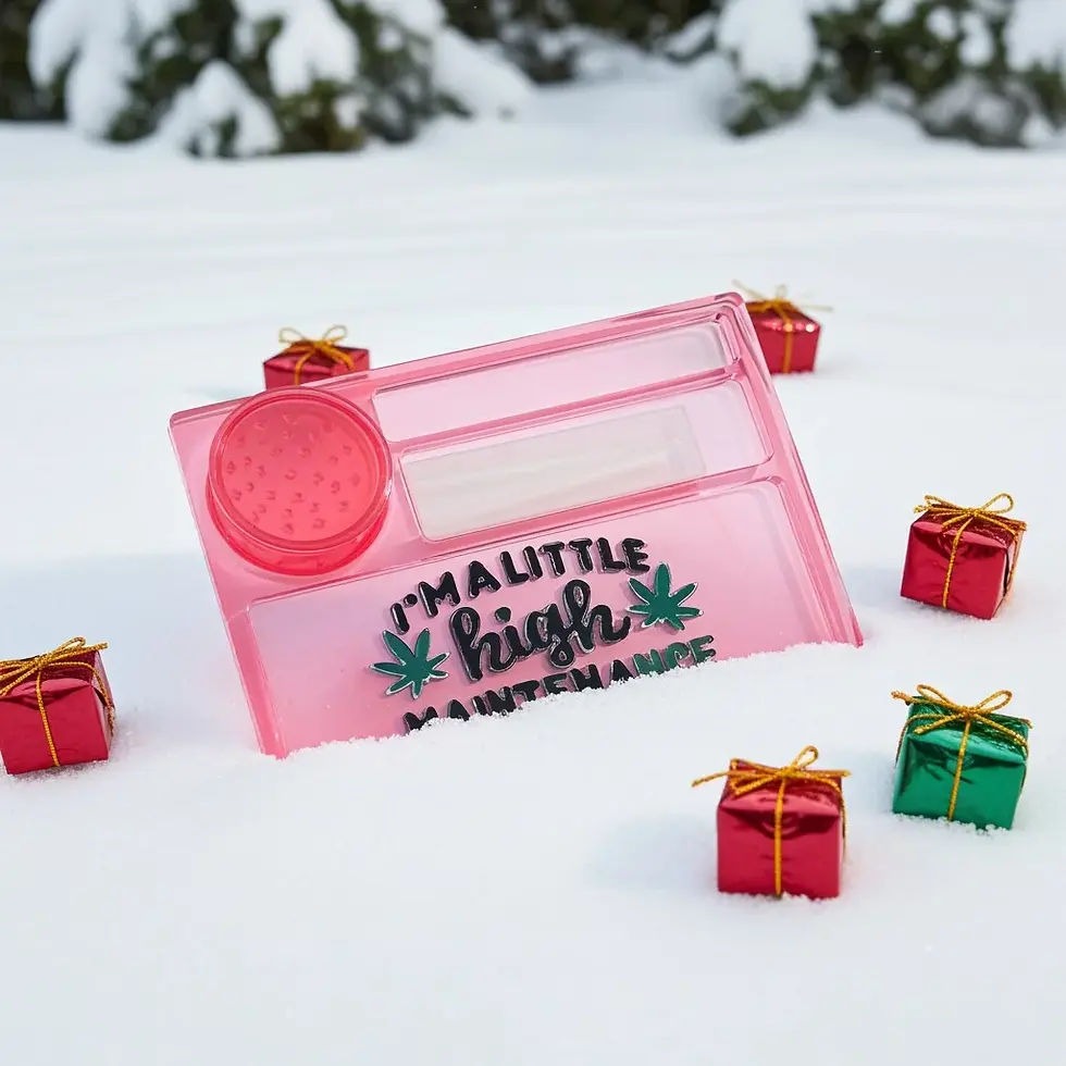 Red tray with I'M A LITTLE high MAINTENACE wording with grinder, in the snow with gifts