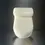 Thumbnail: Mini White toilet with lid on, tilted front view on metal surface