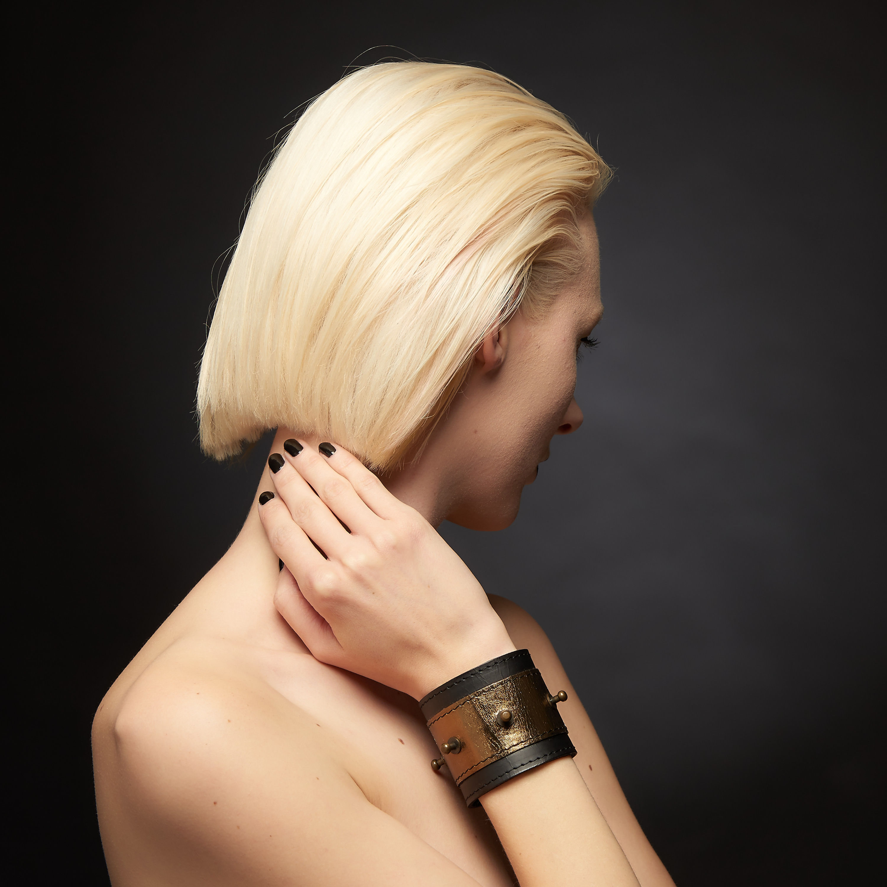 Black and gold leather cuff with metal studs