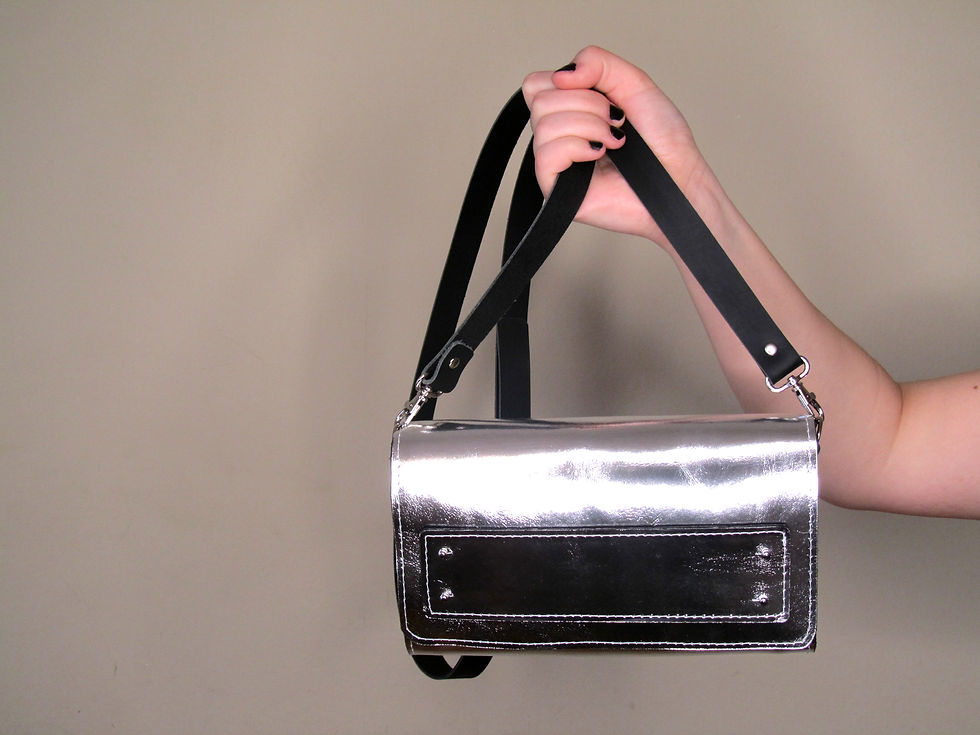 Thumbnail: Metallic leather cross body bag which can be worn as a clutch once strap removed. Silver leather