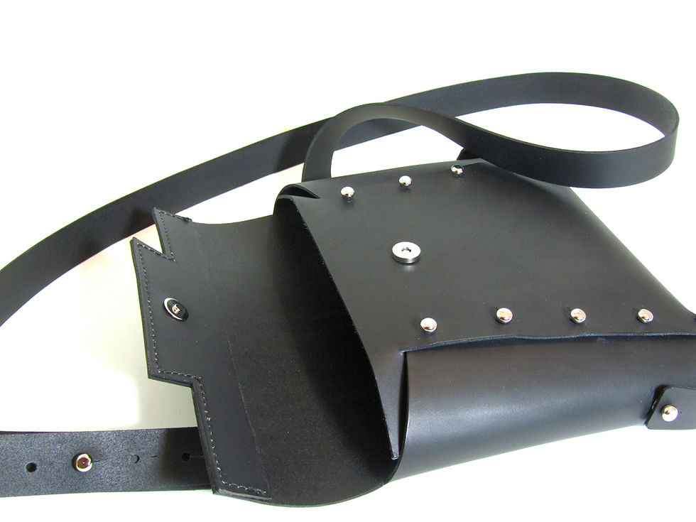 Thumbnail: Black leather cross body bag with studs and origami construction.