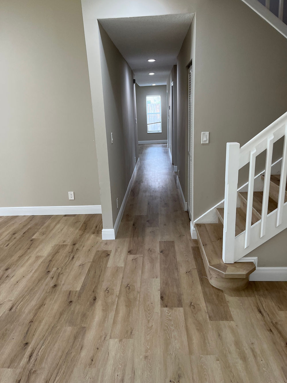Wood look luxury vinyl plank flooring throughout Wellington Florida residence