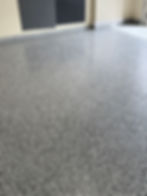 Polyaspartic garage floor coating with decorative flake system in Wellington Florida