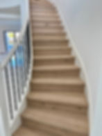Hardwood staircase renovation with oak treads in Wellington Florida home