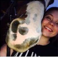 Smiling student with paint lesson horse