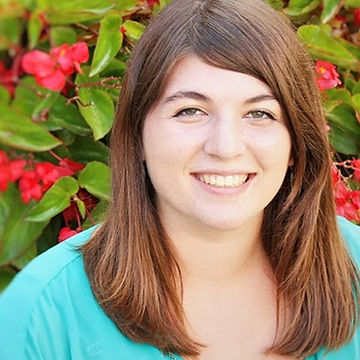 Allison Mulder in front of a flowering tree