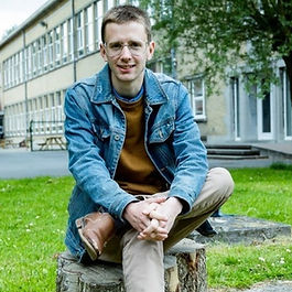 Author Goran Lowie on a Tree Stump
